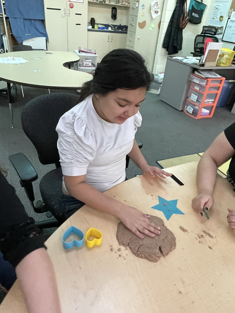student using playdoh