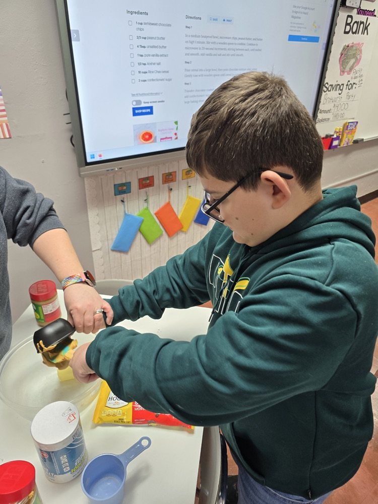 student scooping peanut butter