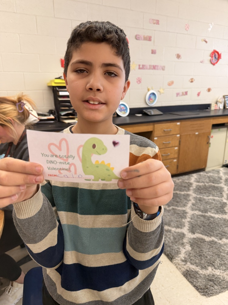 student making valentines