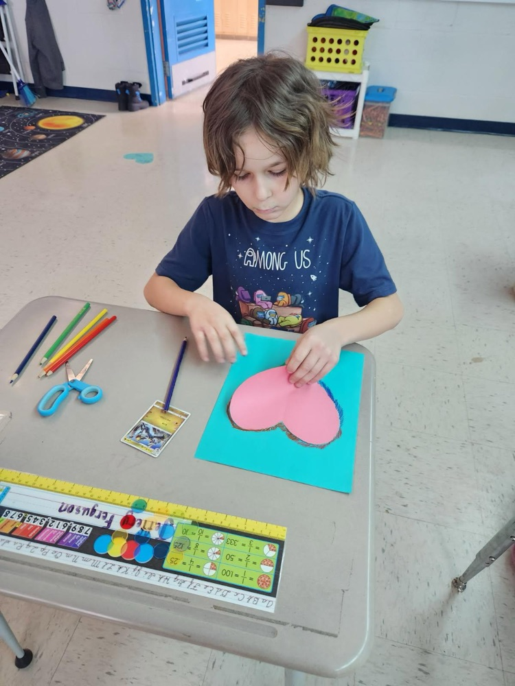 student making valentines