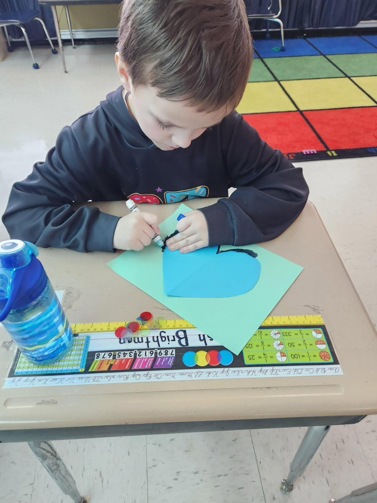 student making valentines