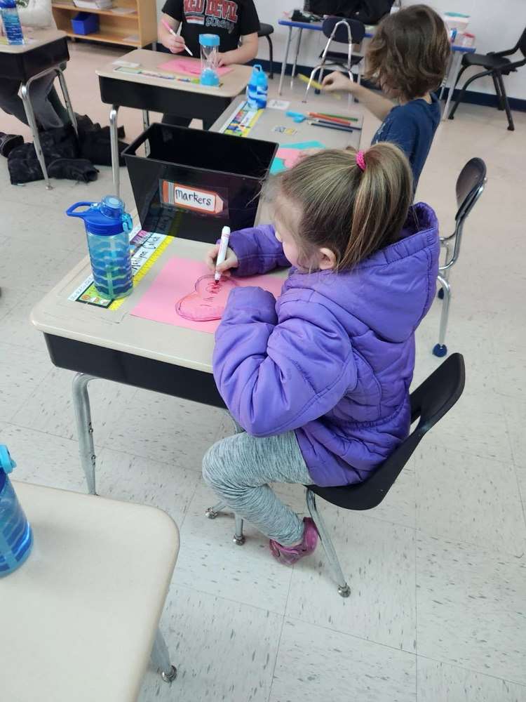 student making valentines