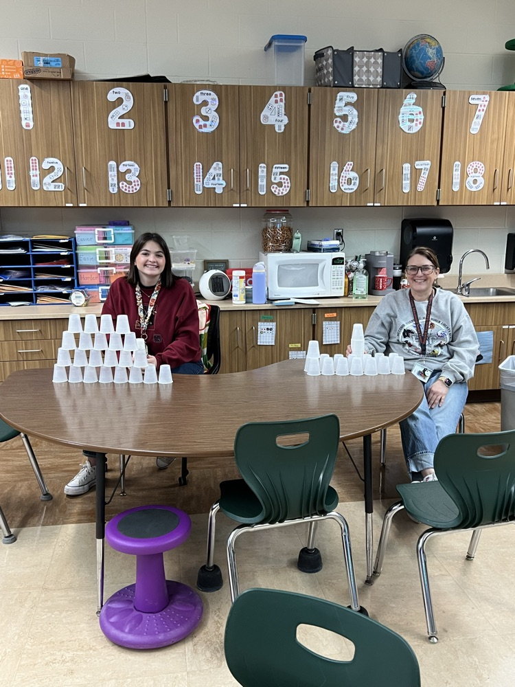 teachers stacking cups