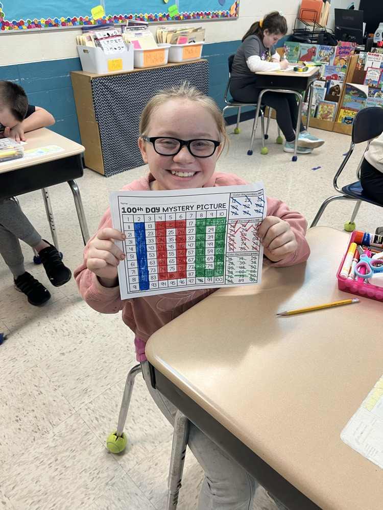 student with 100 day worksheet