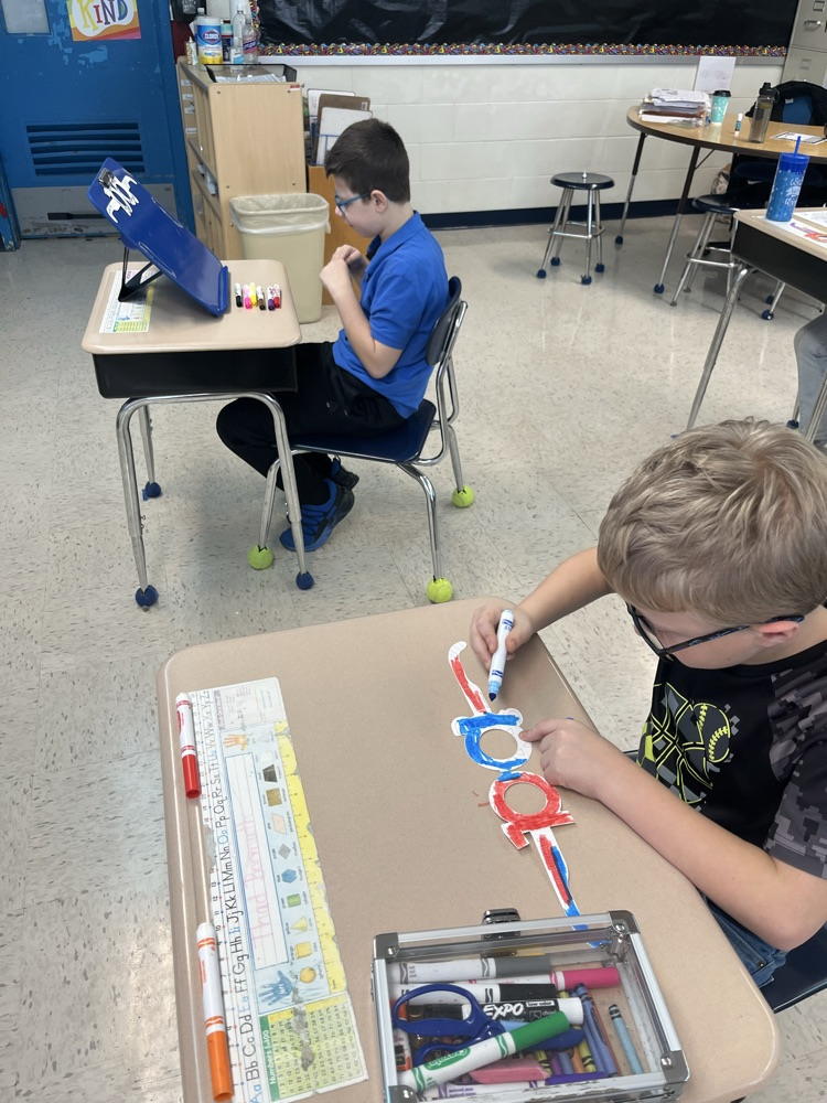 student coloring sunglasses