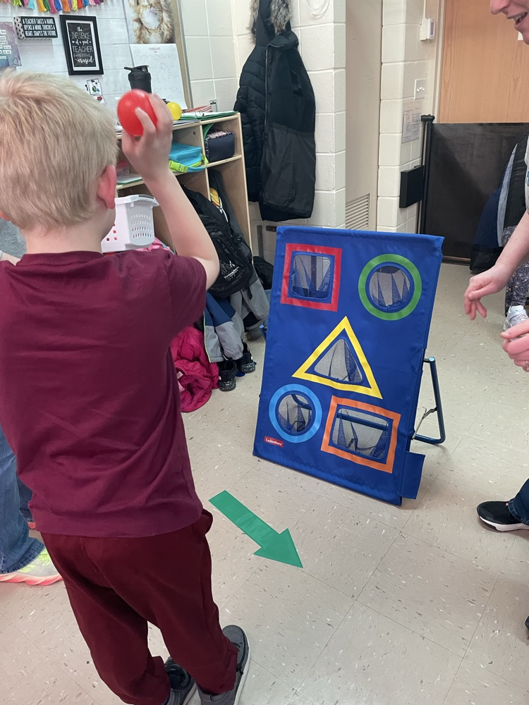 student throwing ball