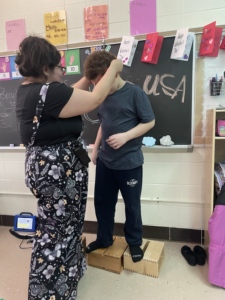 student holding medal