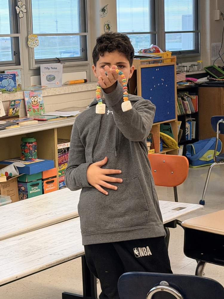 student with candy rainbow