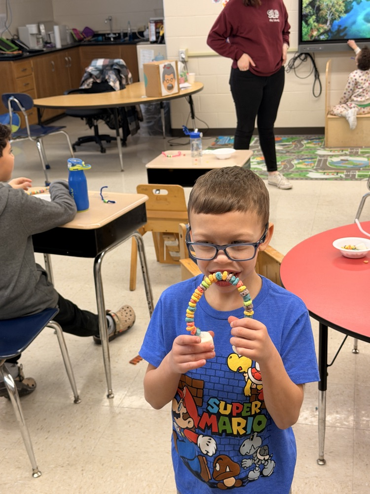 student with candy rainbow