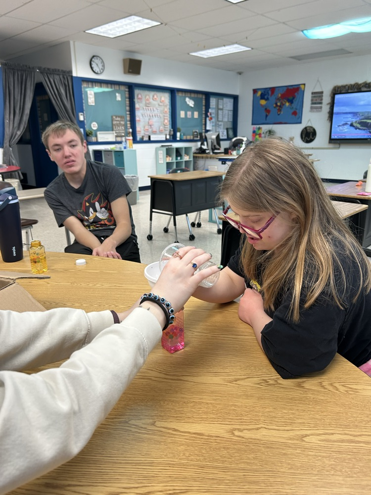 student making calming jar