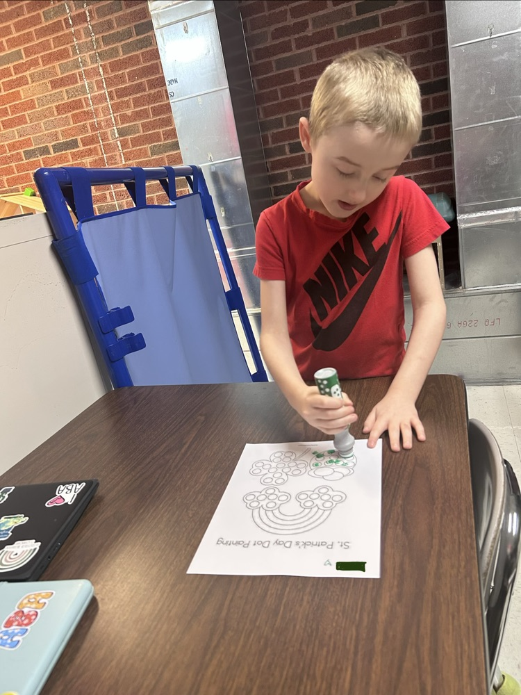 student using bingo stamper on Saint Patrick’s day worksheet