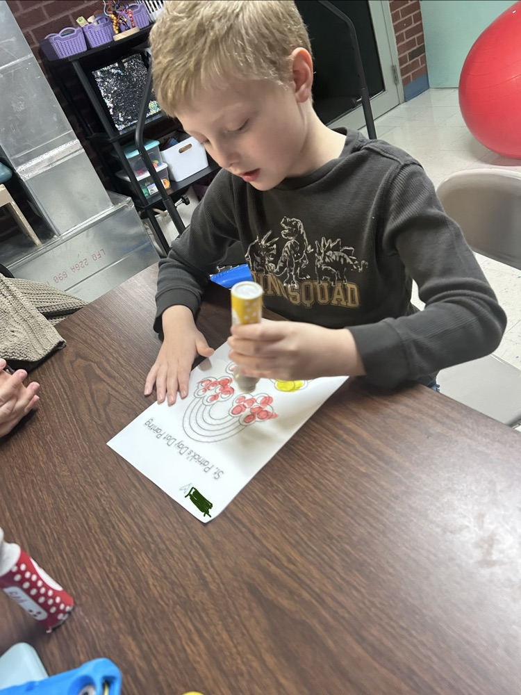 student using bingo stamper on Saint Patrick’s day worksheet
