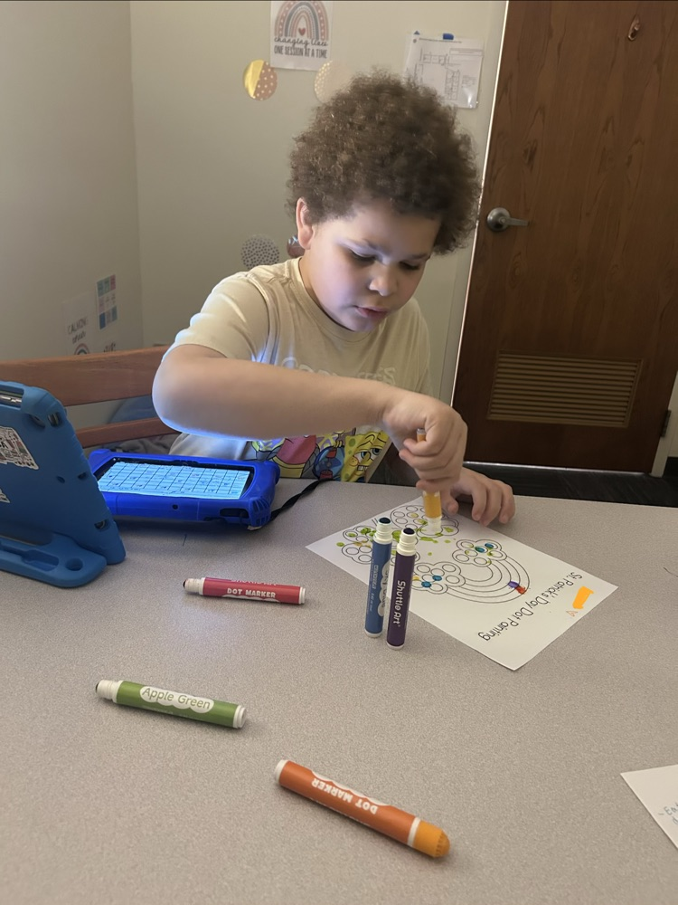 student using bingo stamper on Saint Patrick’s day worksheet