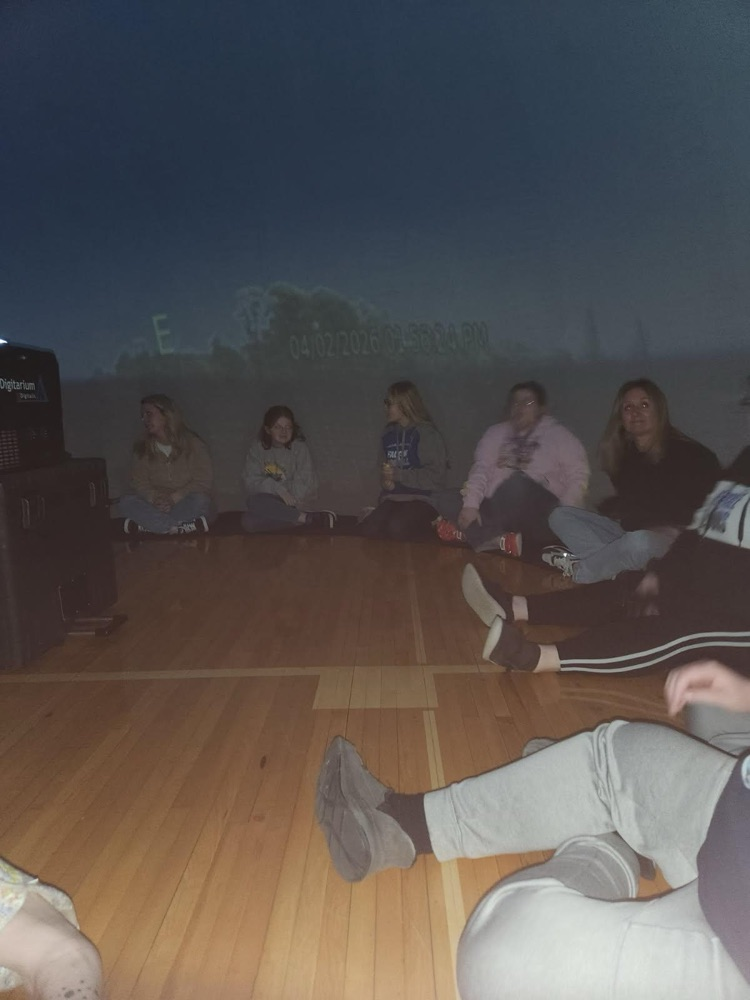 students inside of blow up planetarium