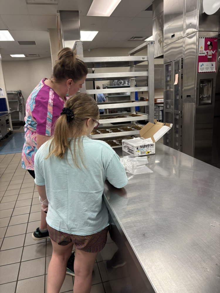 student helping in the kitchen
