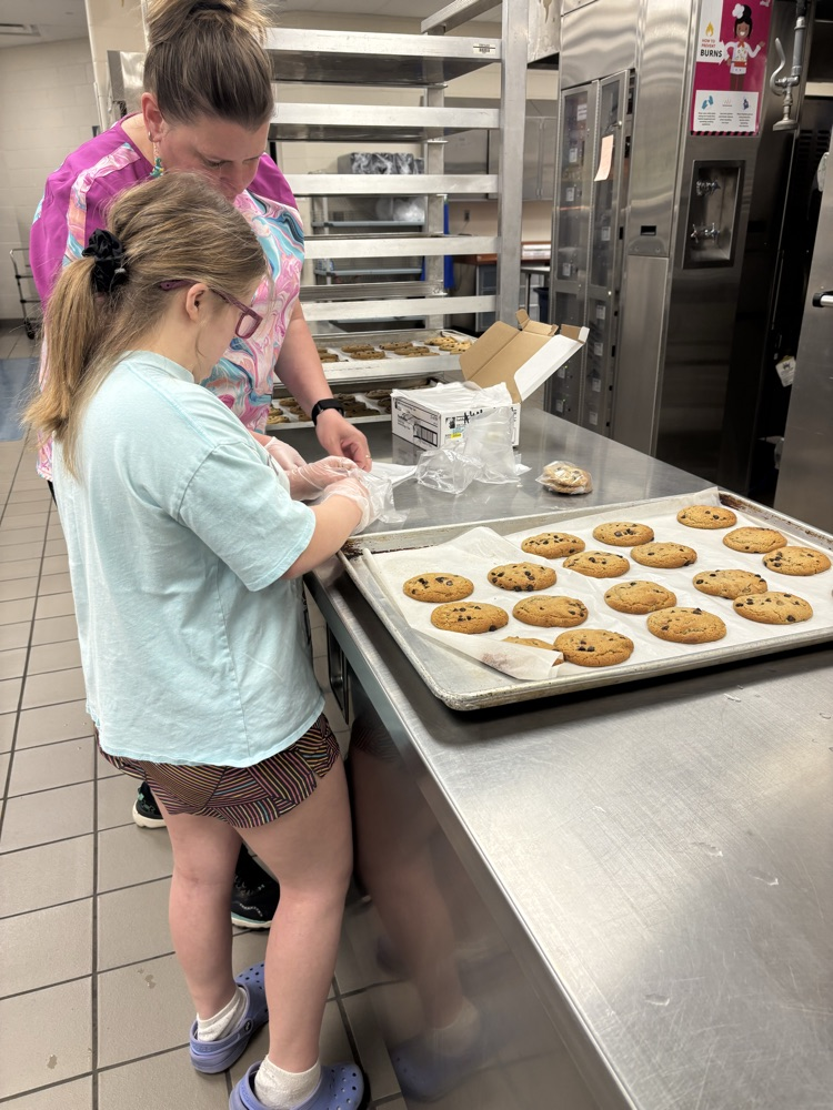 student helping to bake cookies