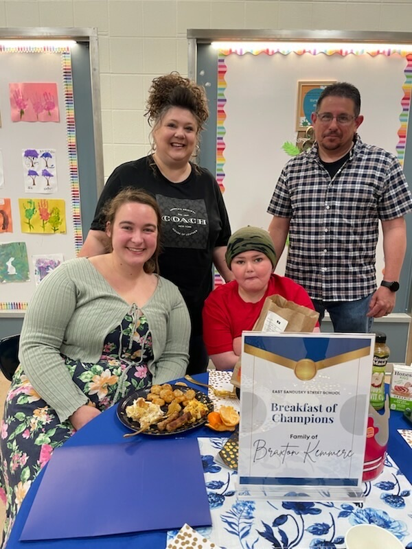 student with teacher and parents