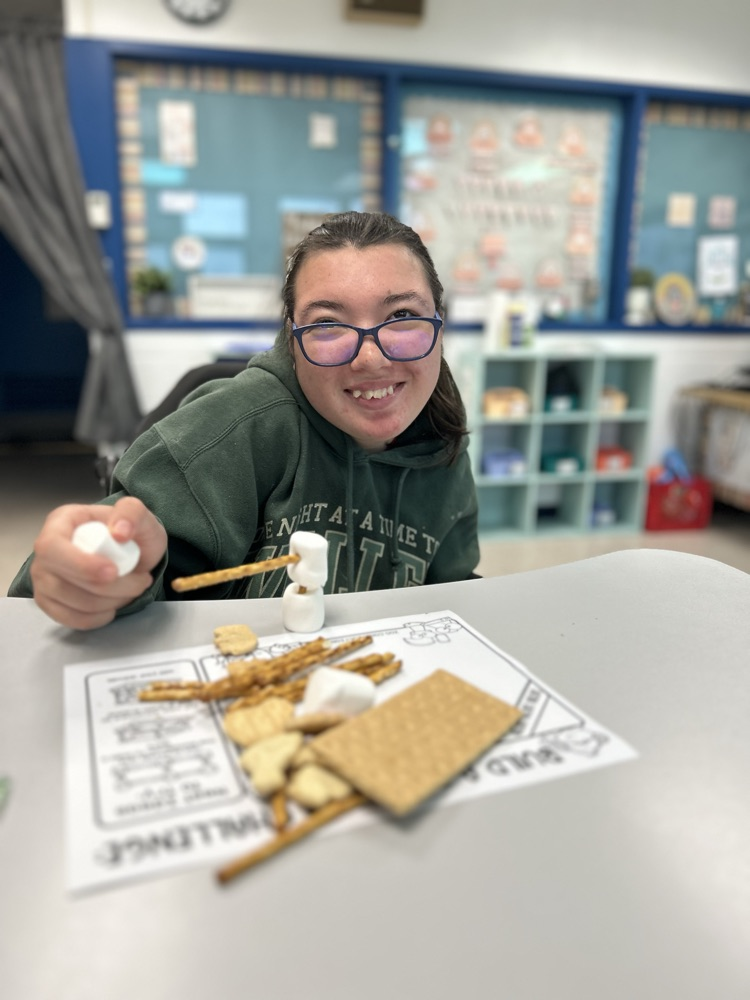student with a marshmallow