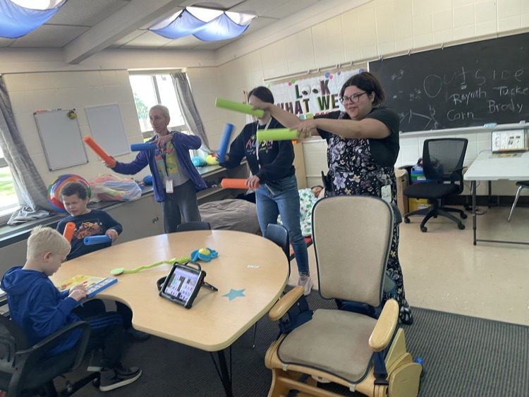 teachers drumming with pool noodles