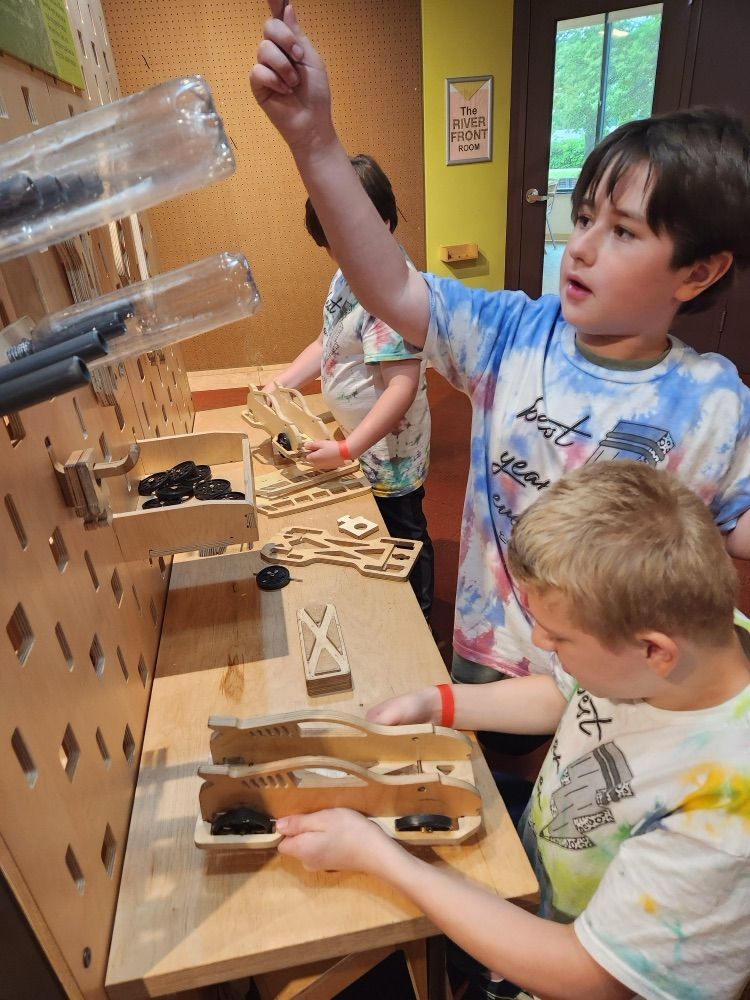 students building wooden cars