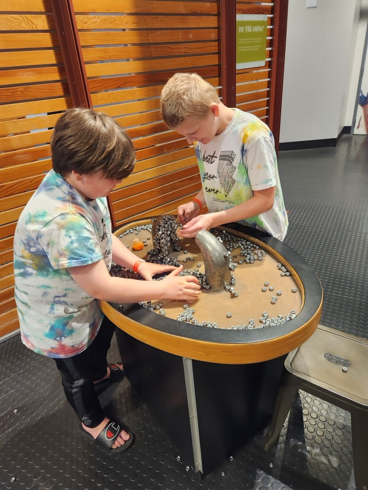 students playing with magnets