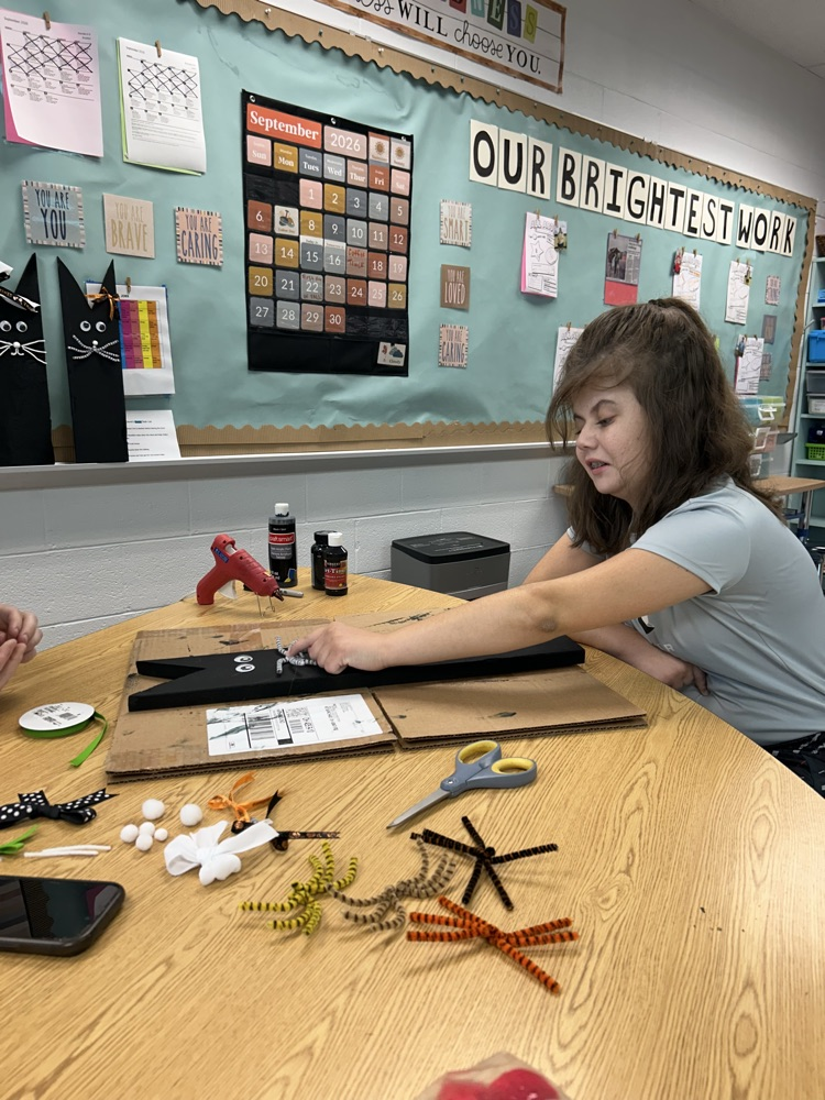 student crafting with wood