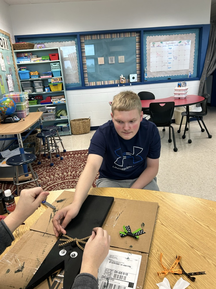 student crafting with wood