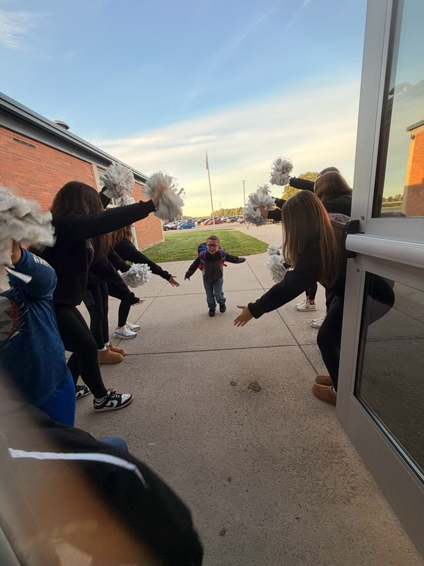 student and cheerleaders
