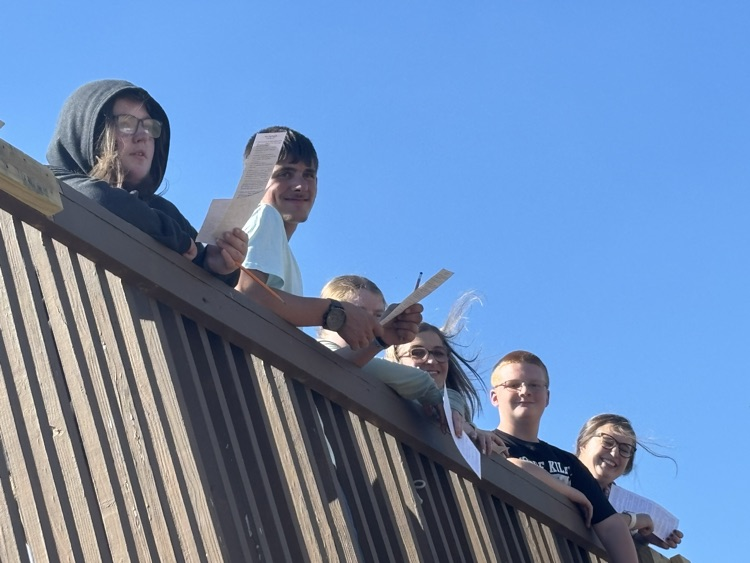 students and aides on bridge