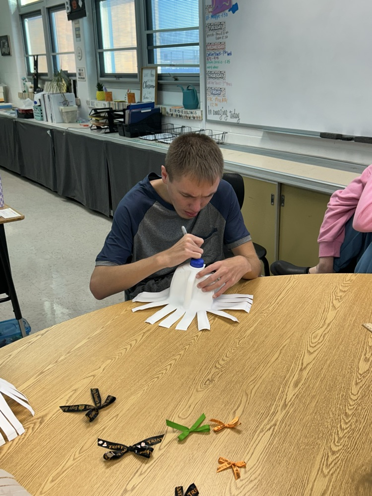 student drawing ghost faces