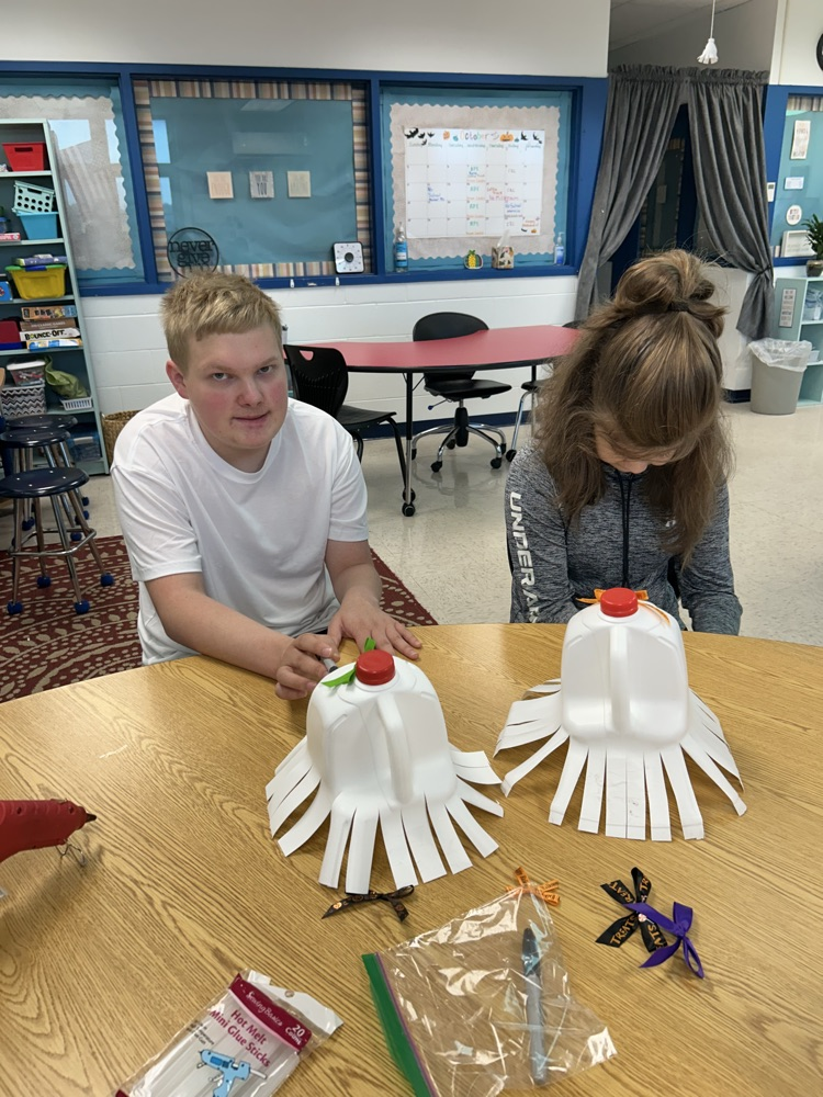 students drawing ghost faces