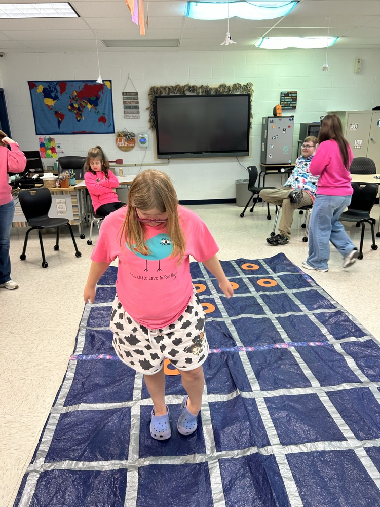 student standing on tarp