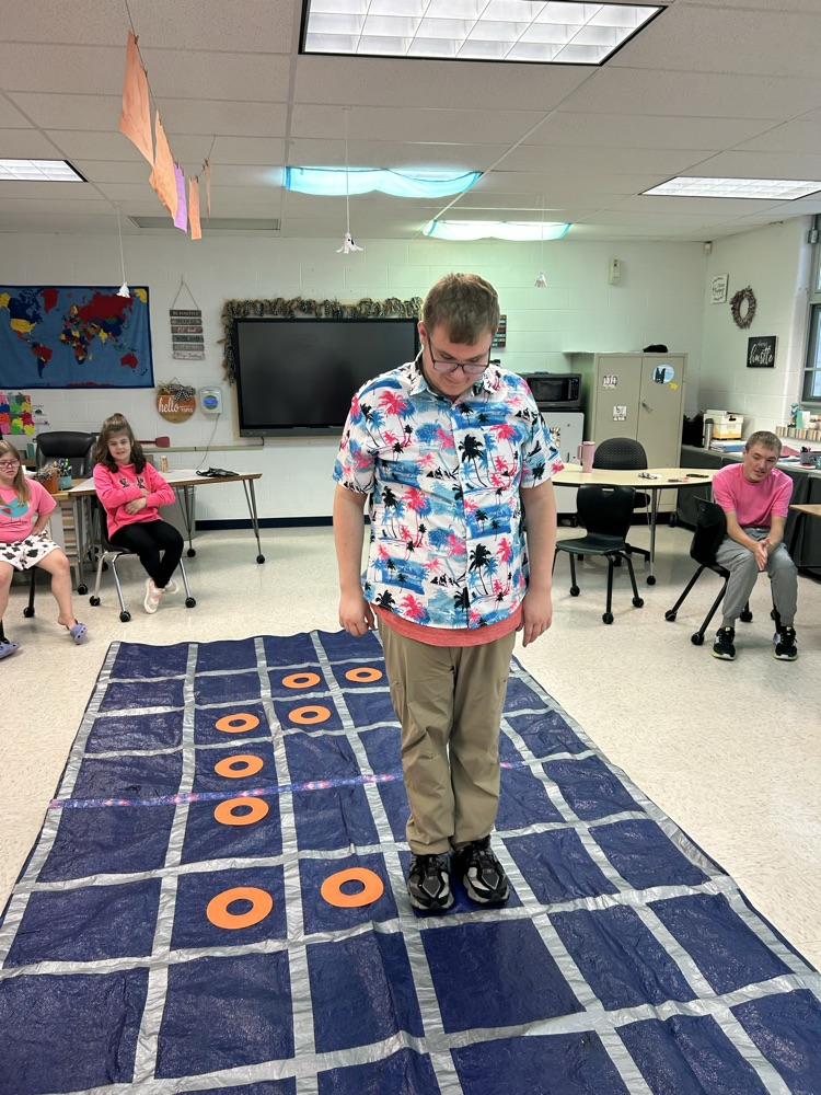 student standing on tarp