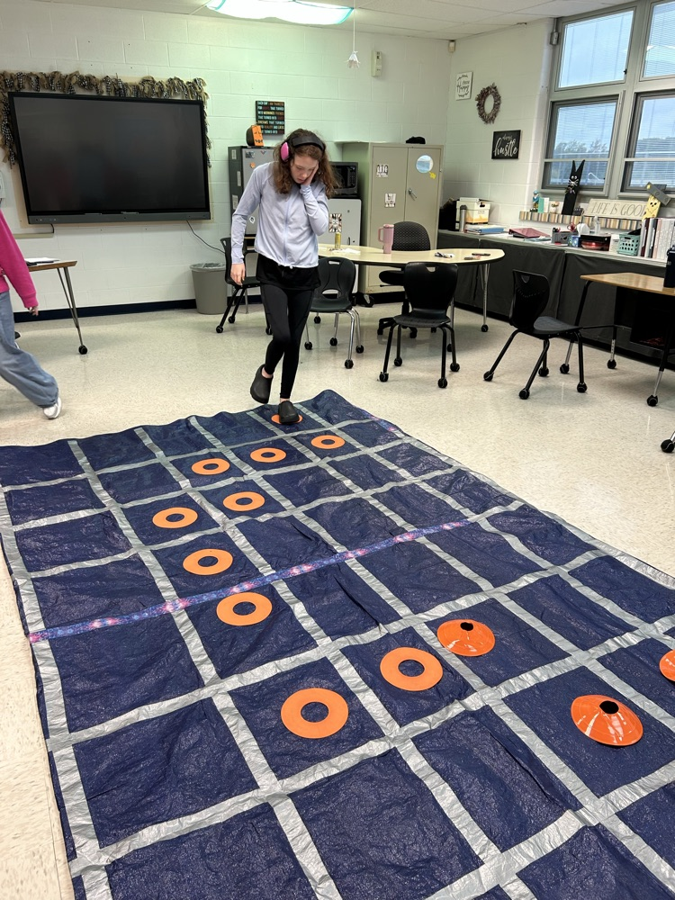 student standing on tarp