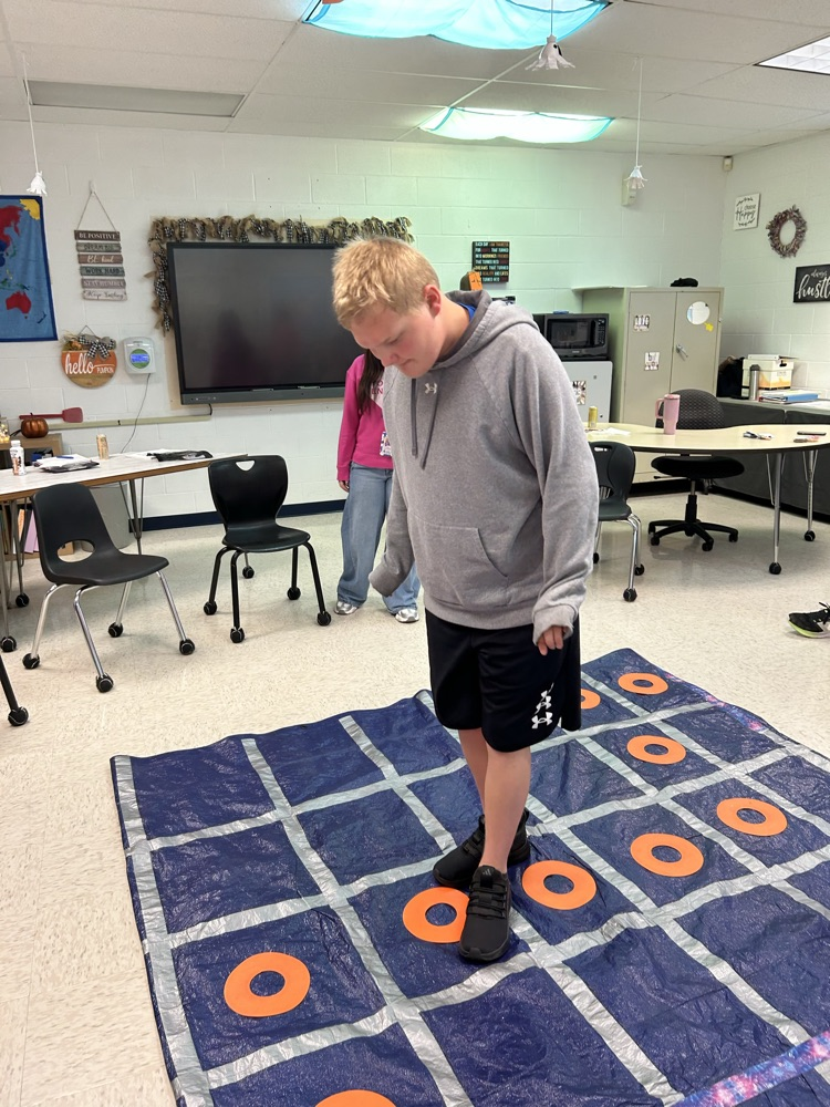student standing on tarp