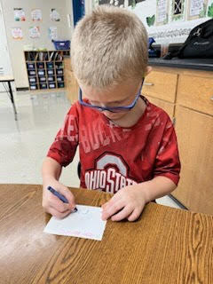 student making Valentine