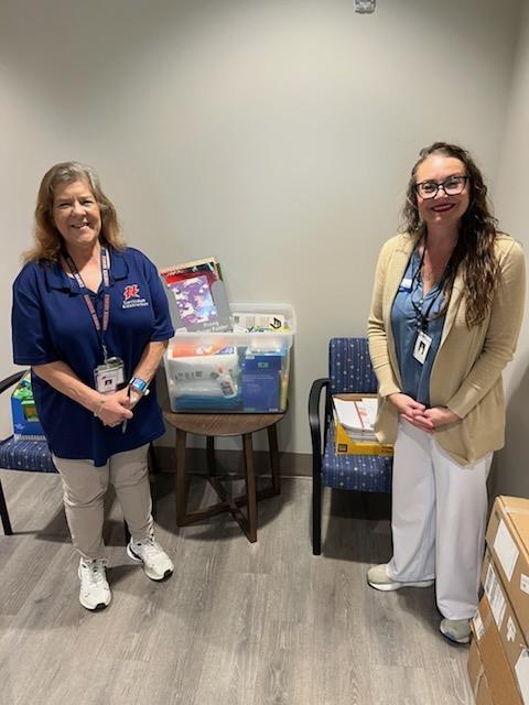 Coast Electric donates school supplies.