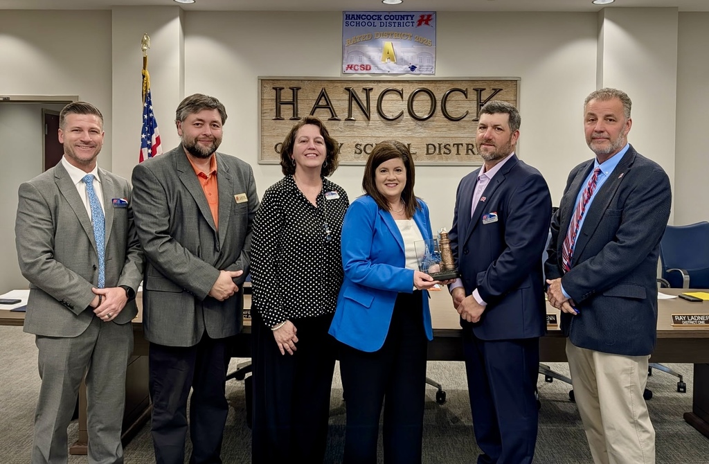 School Board and Superintendent holding Beacon Award
