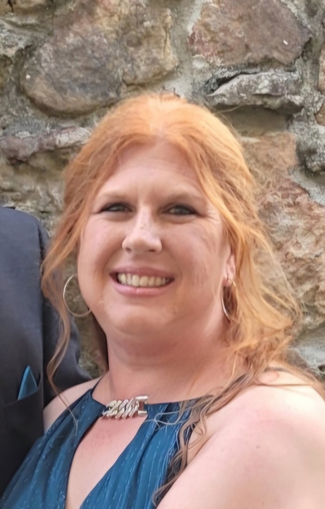 Light Red haired woman with a blue dress