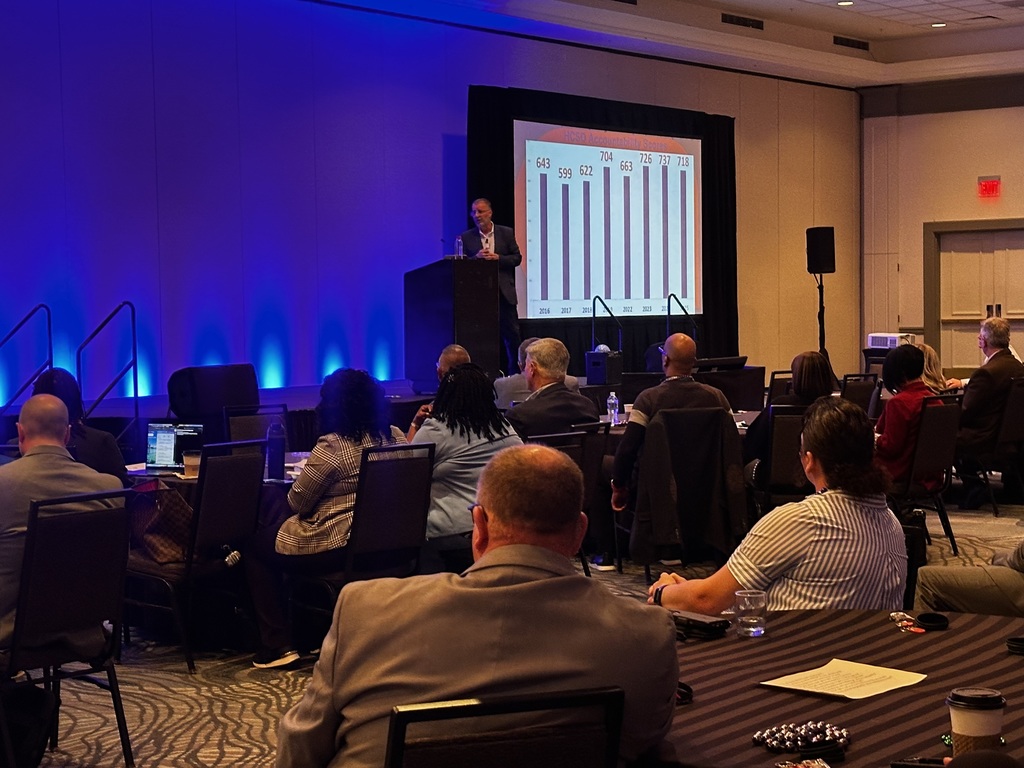 Room of attendees watching Rhett Ladner as keynote speaker.