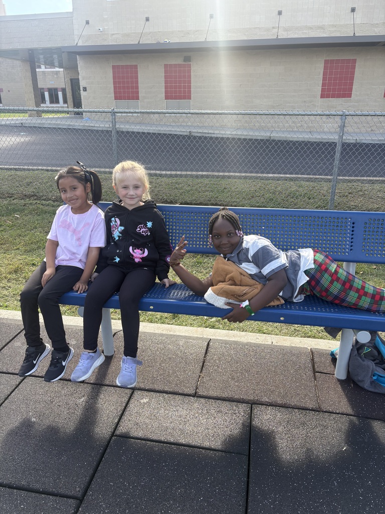 Students sitting on a bench.