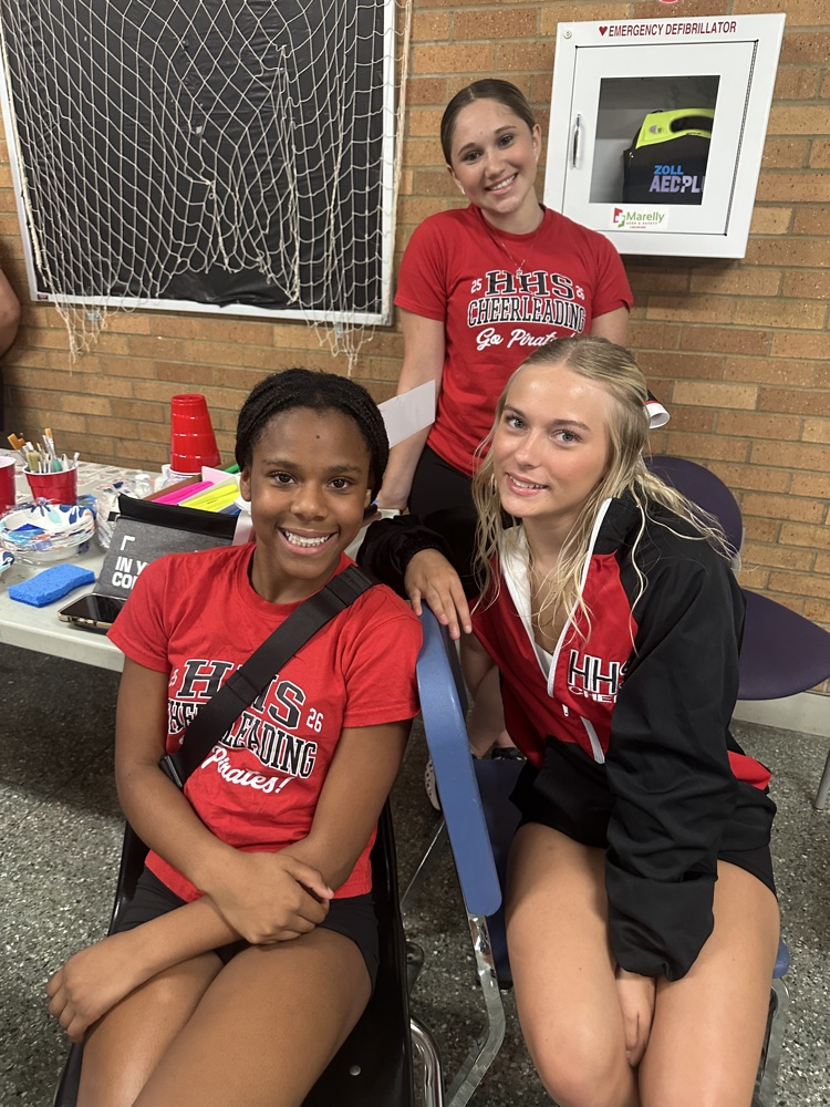 cheer leaders painting faces