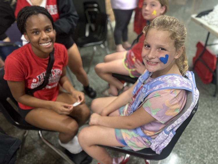 cheer leaders painting faces