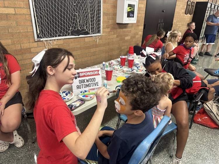 cheer leaders painting faces