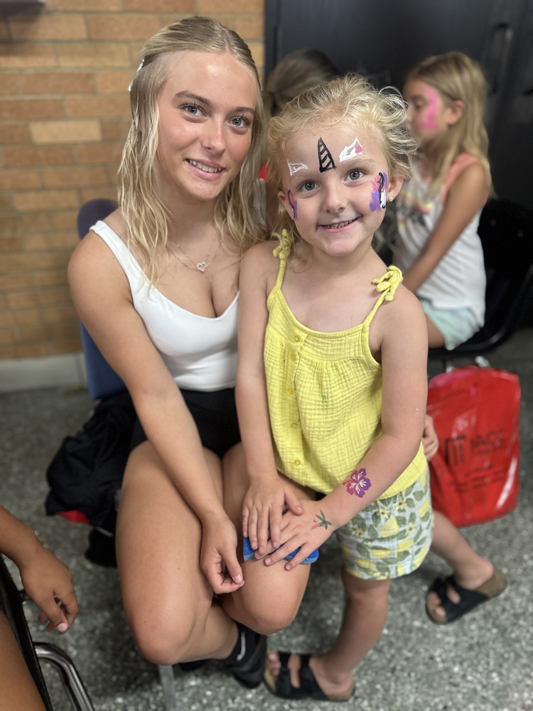 cheer leaders painting faces
