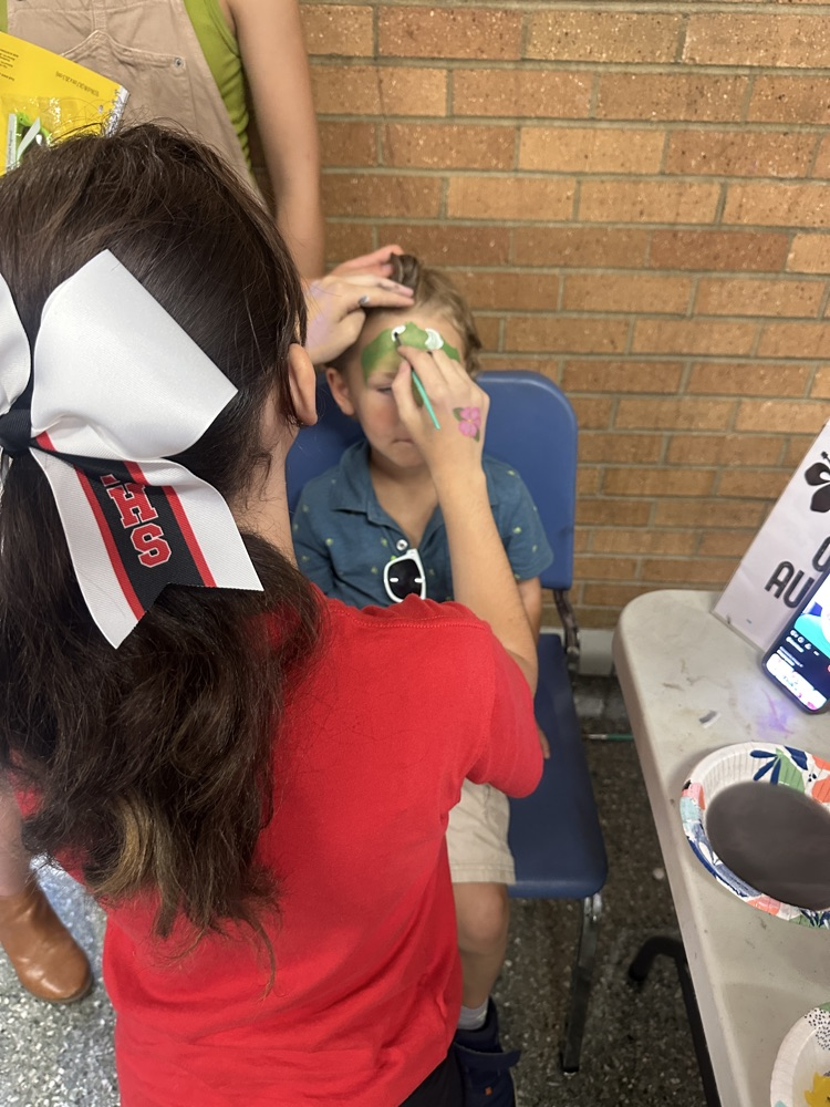 cheer leaders painting faces