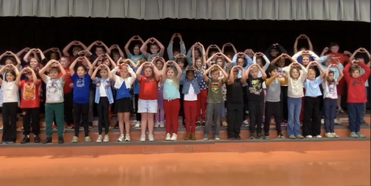4th graders on stage singing