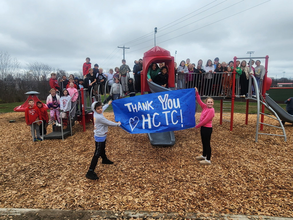 Picture of our new playground with 5th grade students.