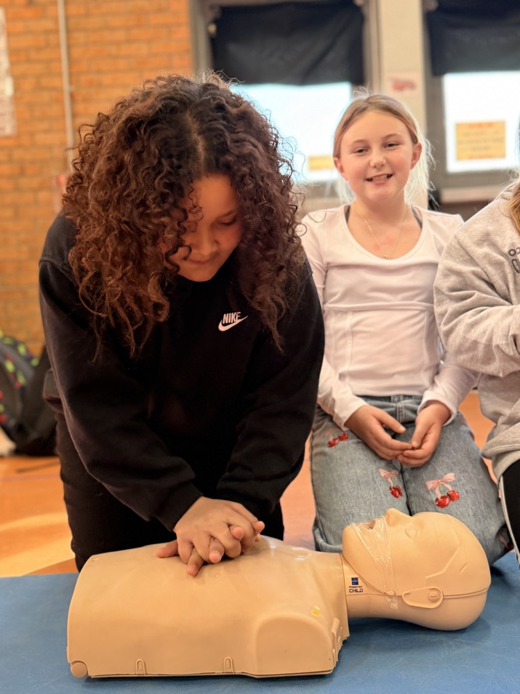 students performing CPR
