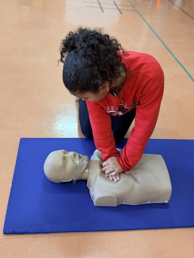 students performing CPR